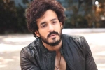 Nagarjuna and Akhil breaking news, Nagarjuna and Akhil film news, nagarjuna s 100th film will have akhil in a crucial role, Bangarraju