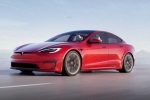 Tesla new electric car breaking news, Tesla new electric car pictures, tesla to launch electric hatchback without a steering wheel, Tesla new electric car